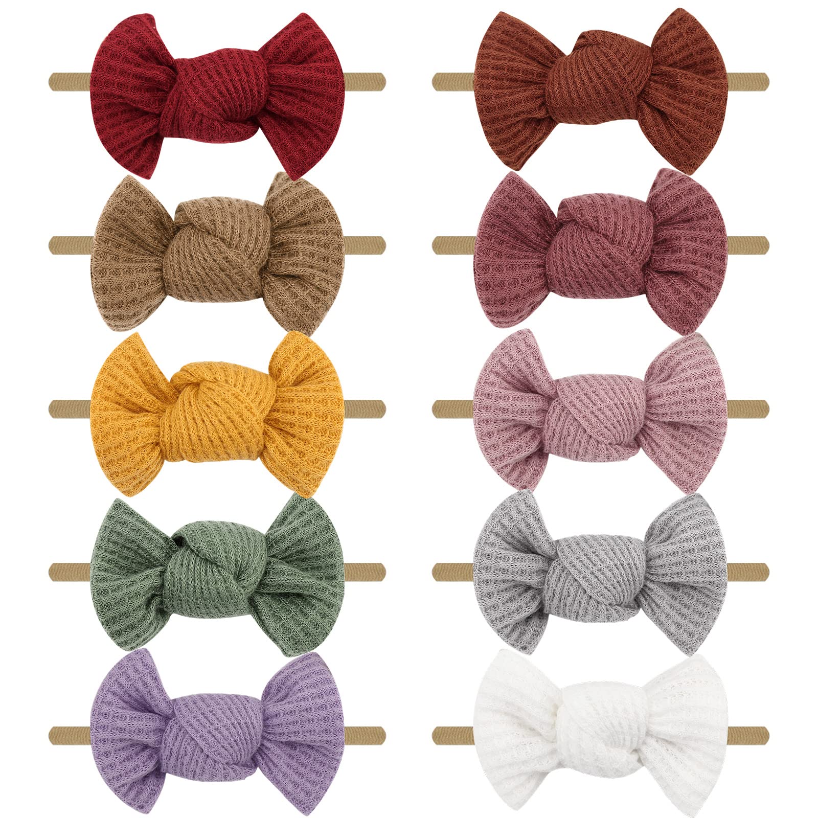 Set of colorful knitted hair bows on wooden sticks against a white background